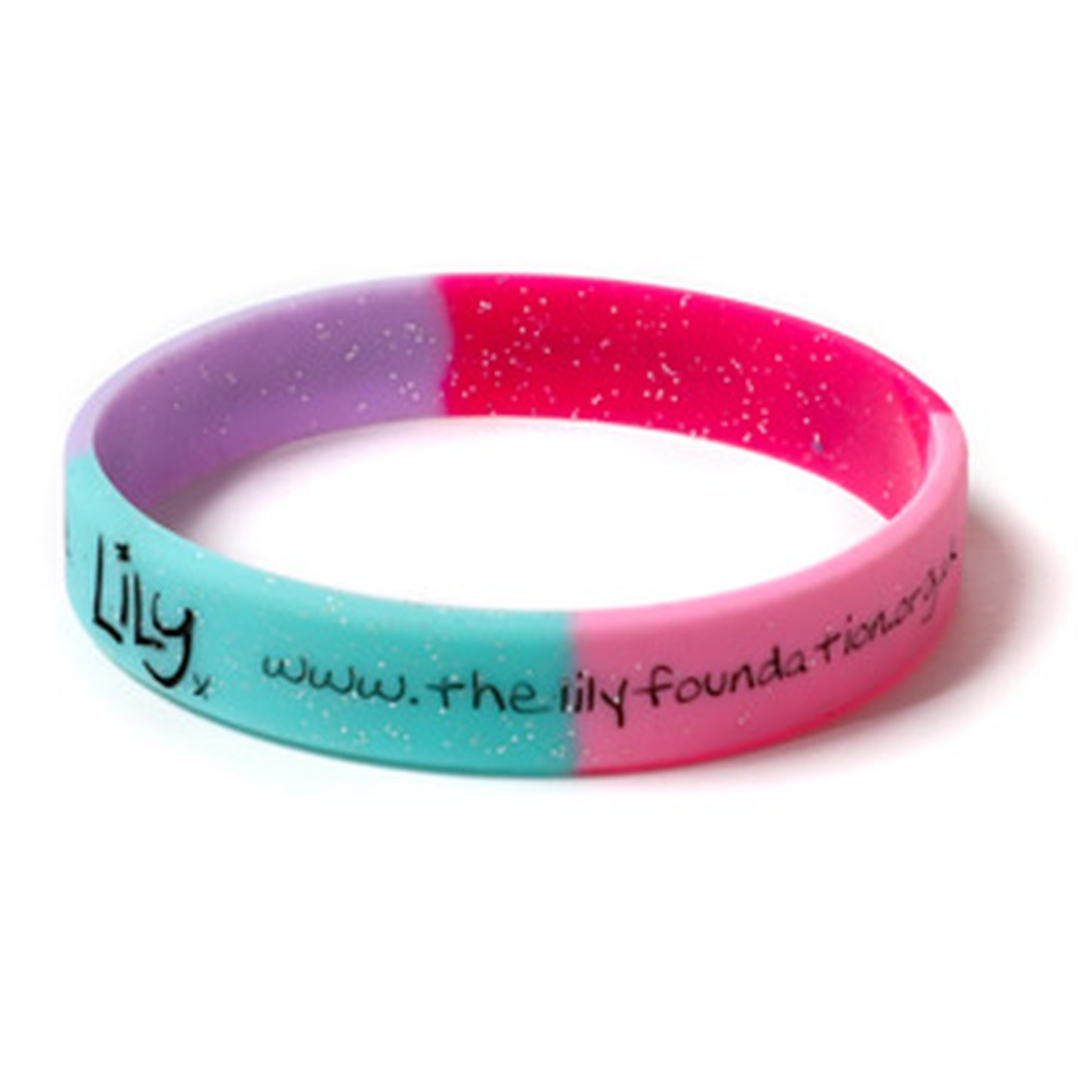 A multicoloured glittery wristband featuring the Lily Foundation logo and website address.
