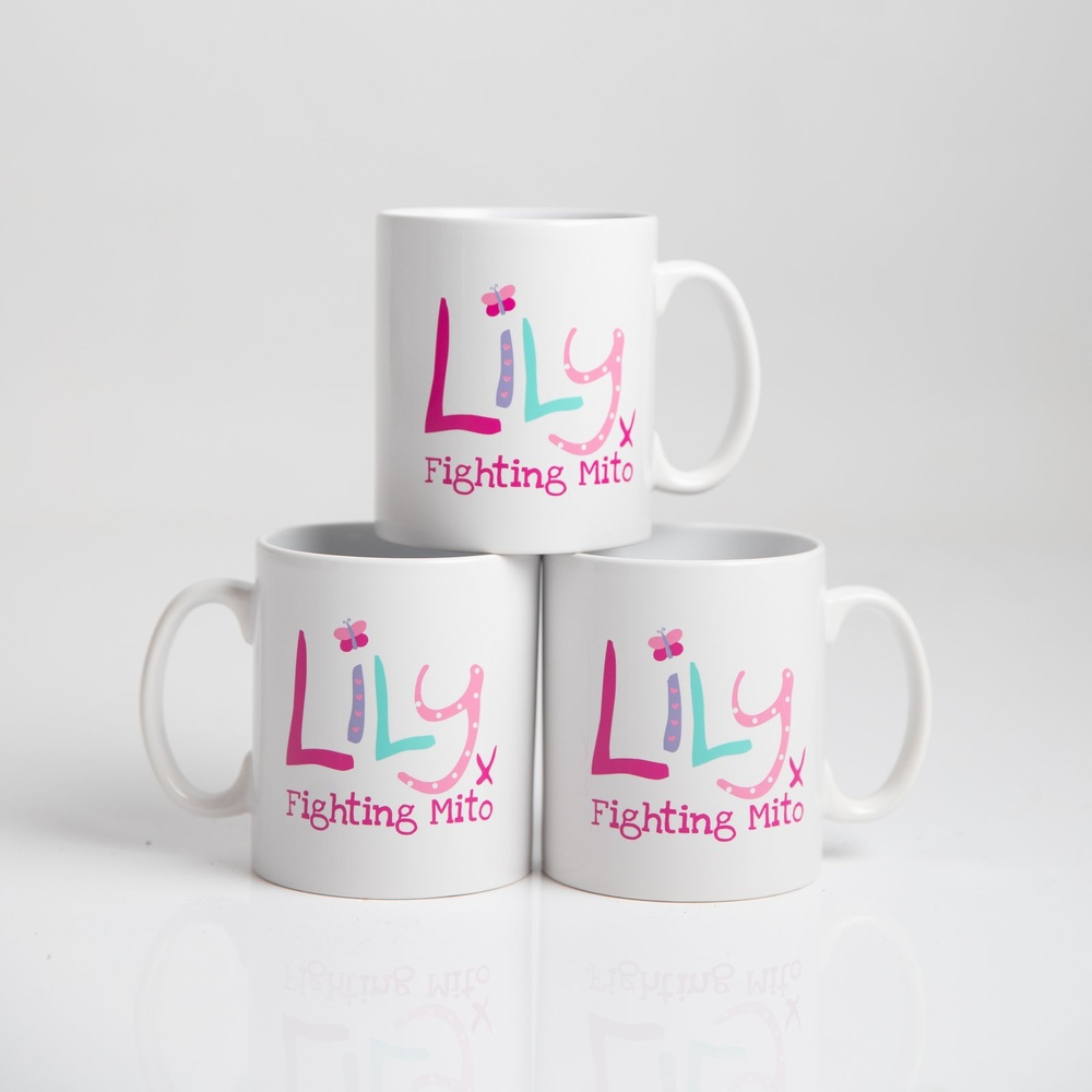 A stack of three white mugs featuring the Lily Foundation logo and the words fighting mito.