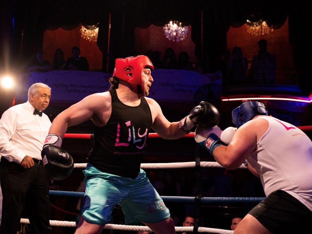 A Lily boxer throws a punch while his opponent ducks away