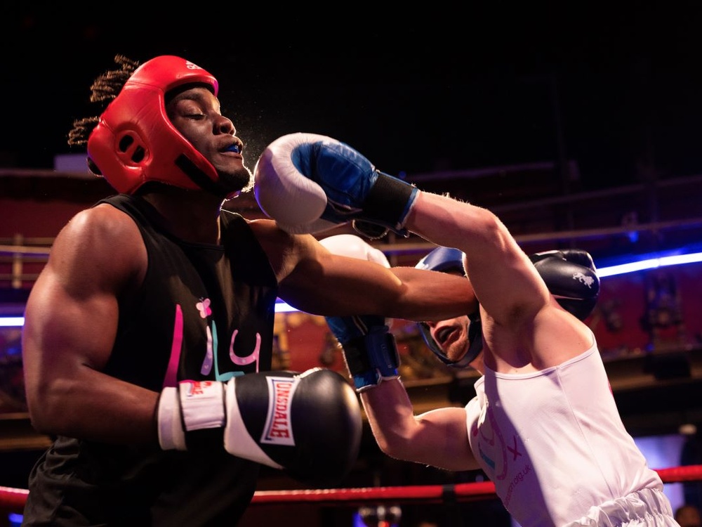 One Lily boxer throwing a punch at the other at the Clapham Grand