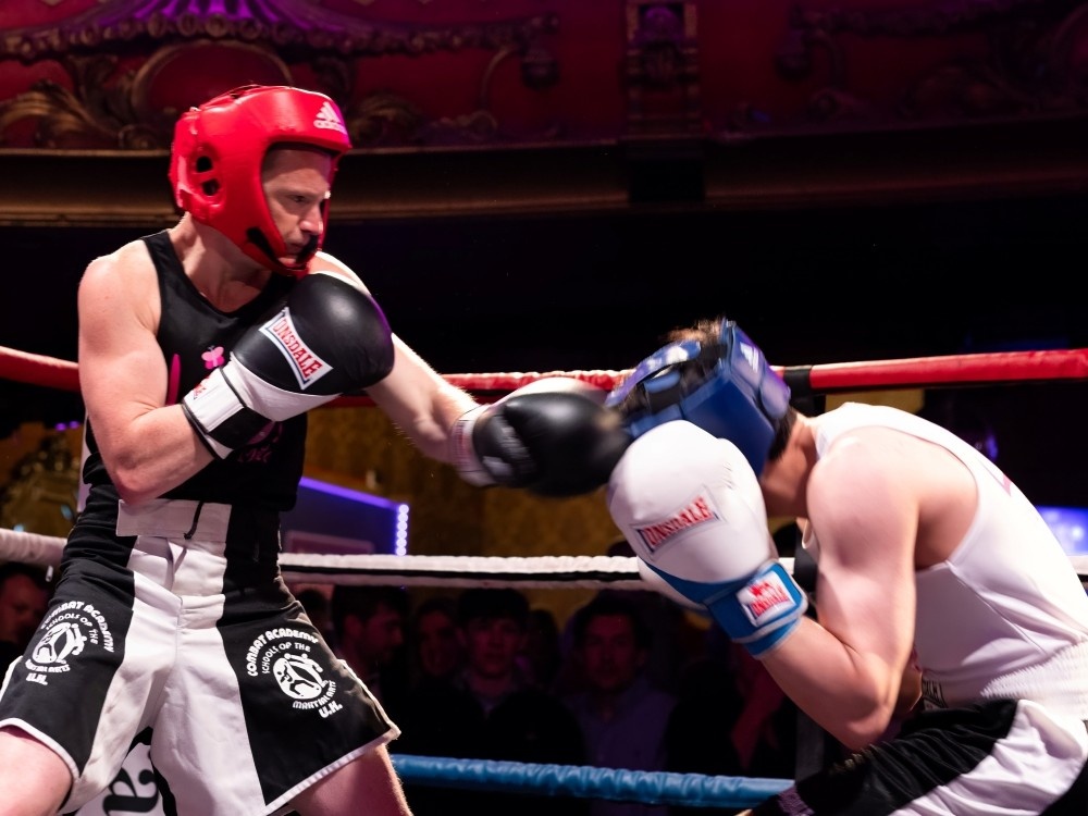Punches being thrown in the ring between two Lily Fight Night boxers