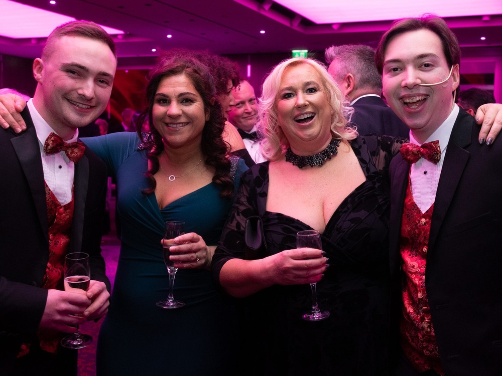 A group of guests arriving at the Lily Charity Ball