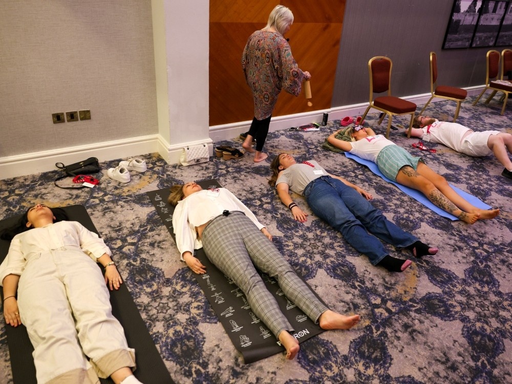A group of mito parents enjoying a sound bath at the Lily family weekend
