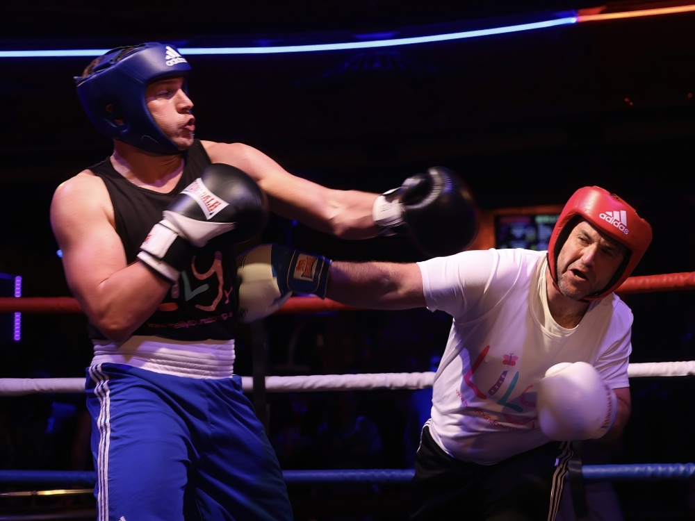 One Lily fighter ducks out of the way as the other takes a punch