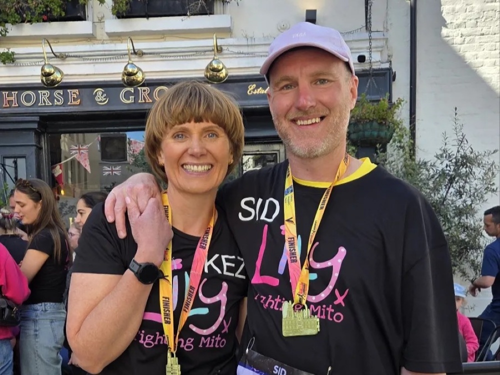 Two Lily Foundation runners with their London Landmarks medals