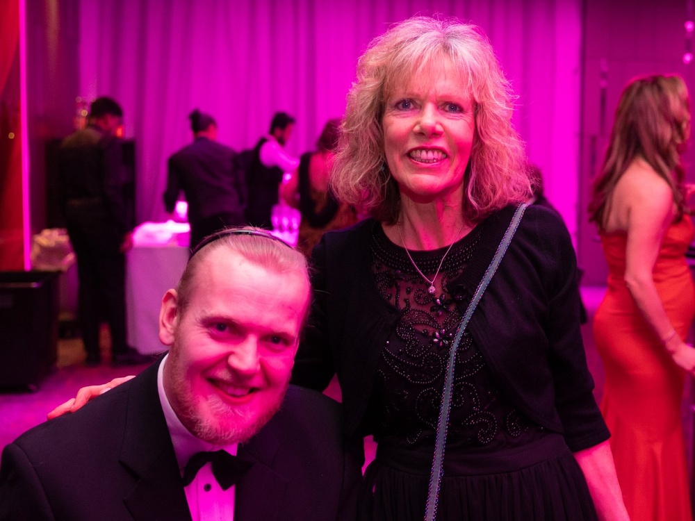 A young adult mito patient with his mother at the Lily ball