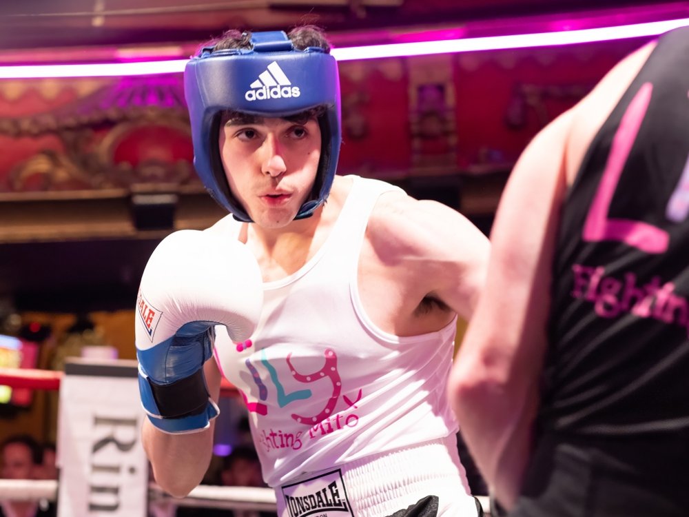 Close-up of a boxer in a Lily vest in the boxing ring