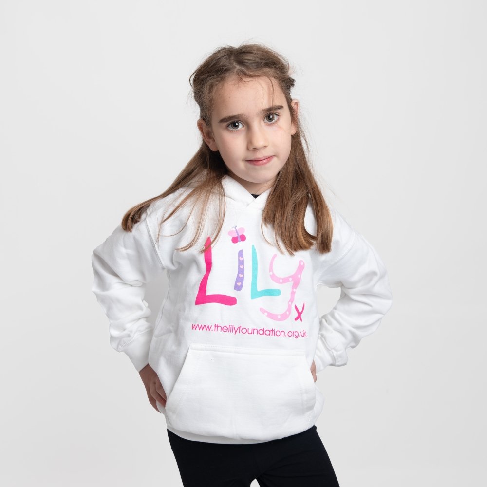A young girl wearing a white hoodie featuring the Lily Foundation logo and website address.