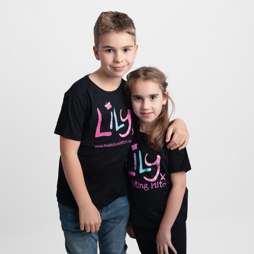 A young boy and girl both wearing a black t-shirt featuring the Lily Foundation logo and the text fighting mito.