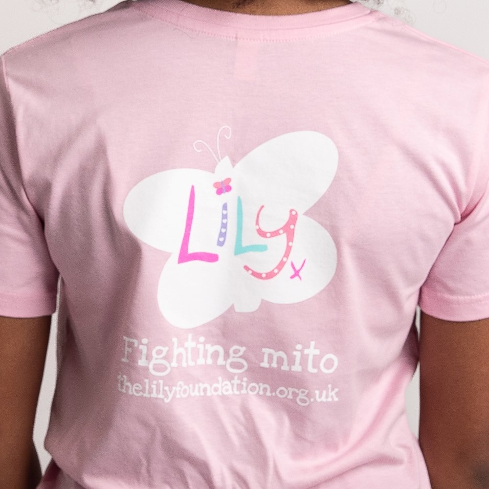 The back of a young girl wearing a pink t-shirt with the Lily Foundation butterfly logo and Fighting Mito strapline