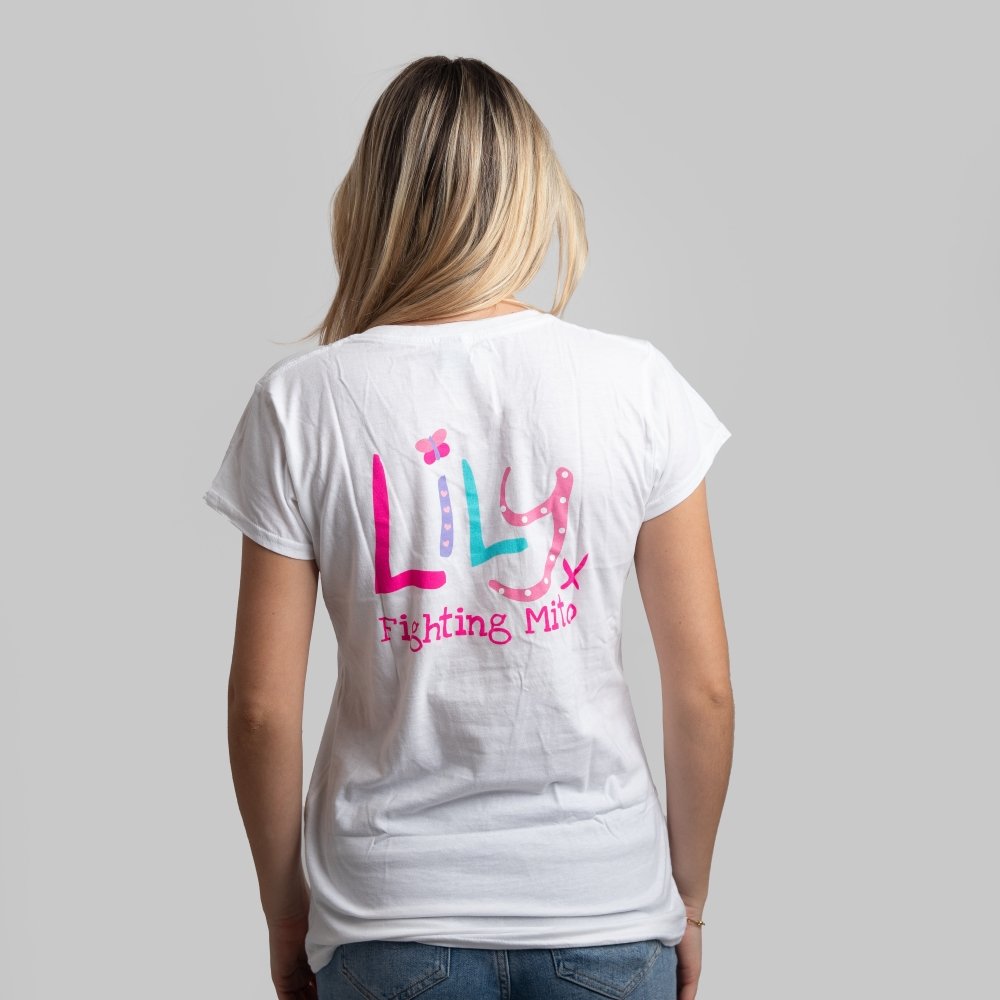 The back of a woman in a white t-shirt featuring the Lily logo and Fighting Mito underneath