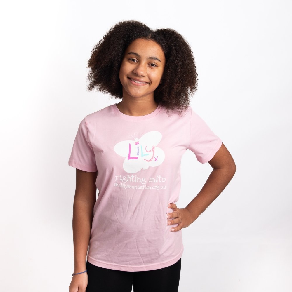 A young girl wearing a pink t-shirt featuring the Lily Foundation butterfly logo & the text Fighting Mito.