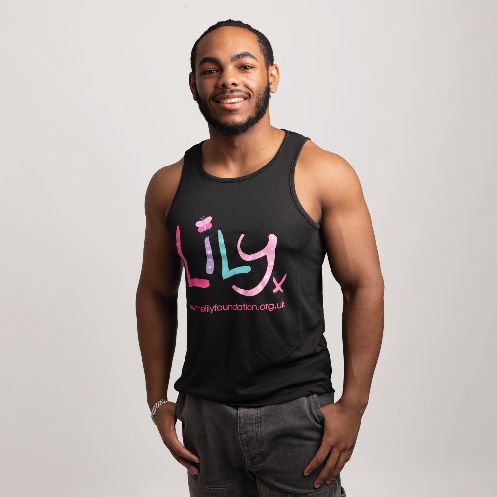 A smiling man in a black vest featuring the Lily Foundation logo and website address.
