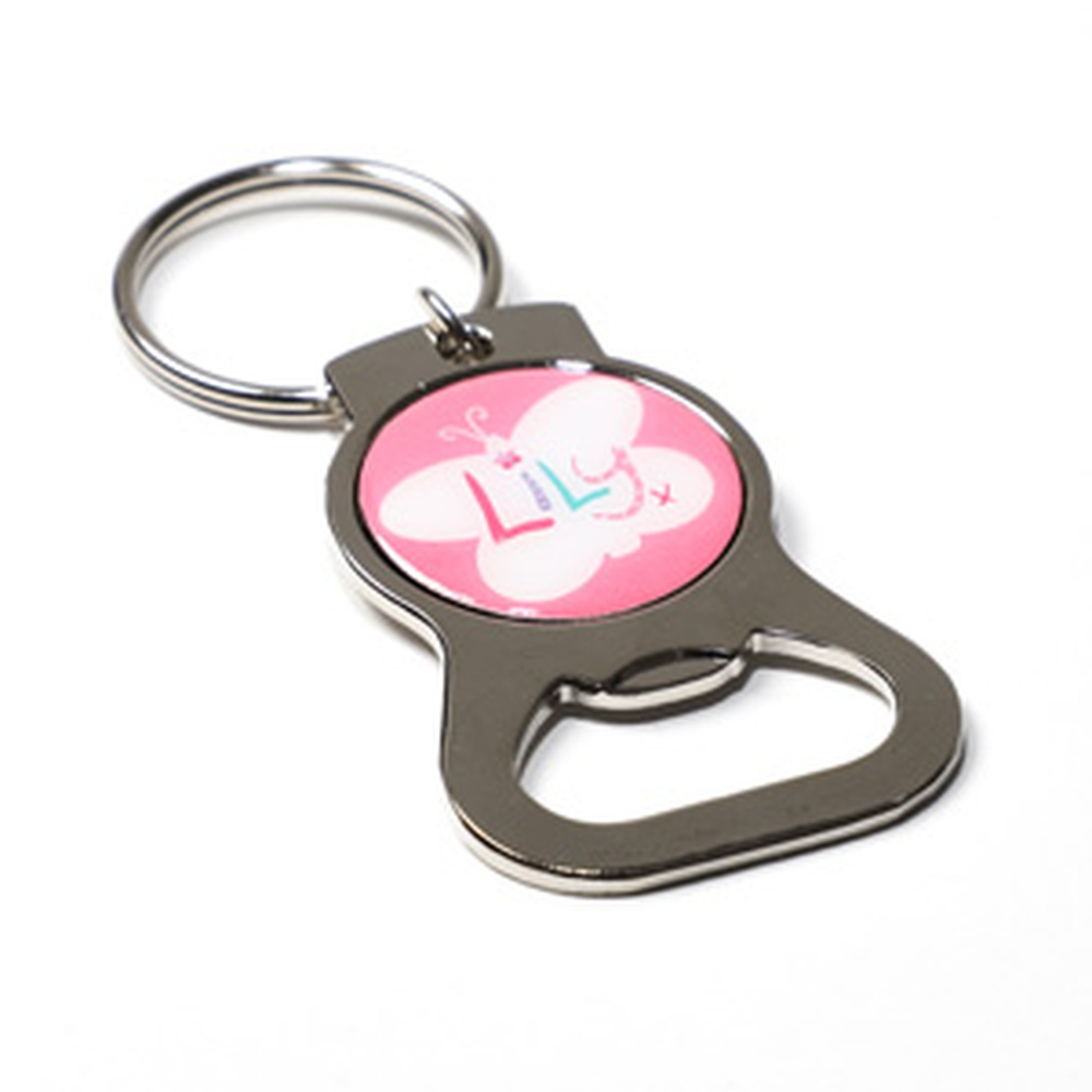 A metal bottle opener with a pink circle in the center, featuring the Lily Foundation logo.