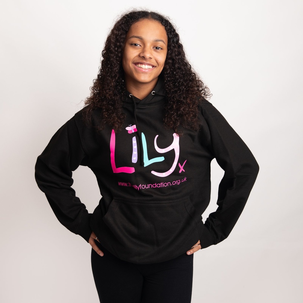 A young girl in a black hoodie featuring the Lily Foundation logo and website address.