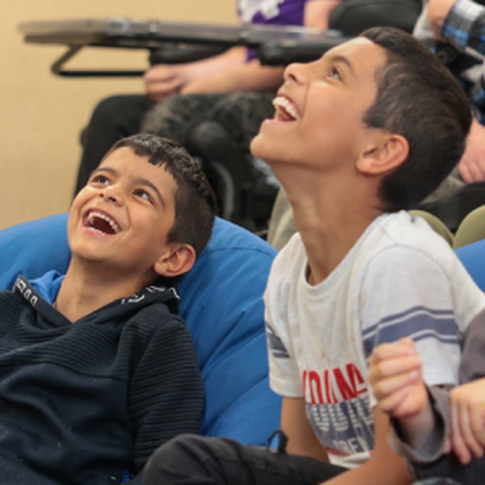 Two young boys at the Lily family weekend laughing