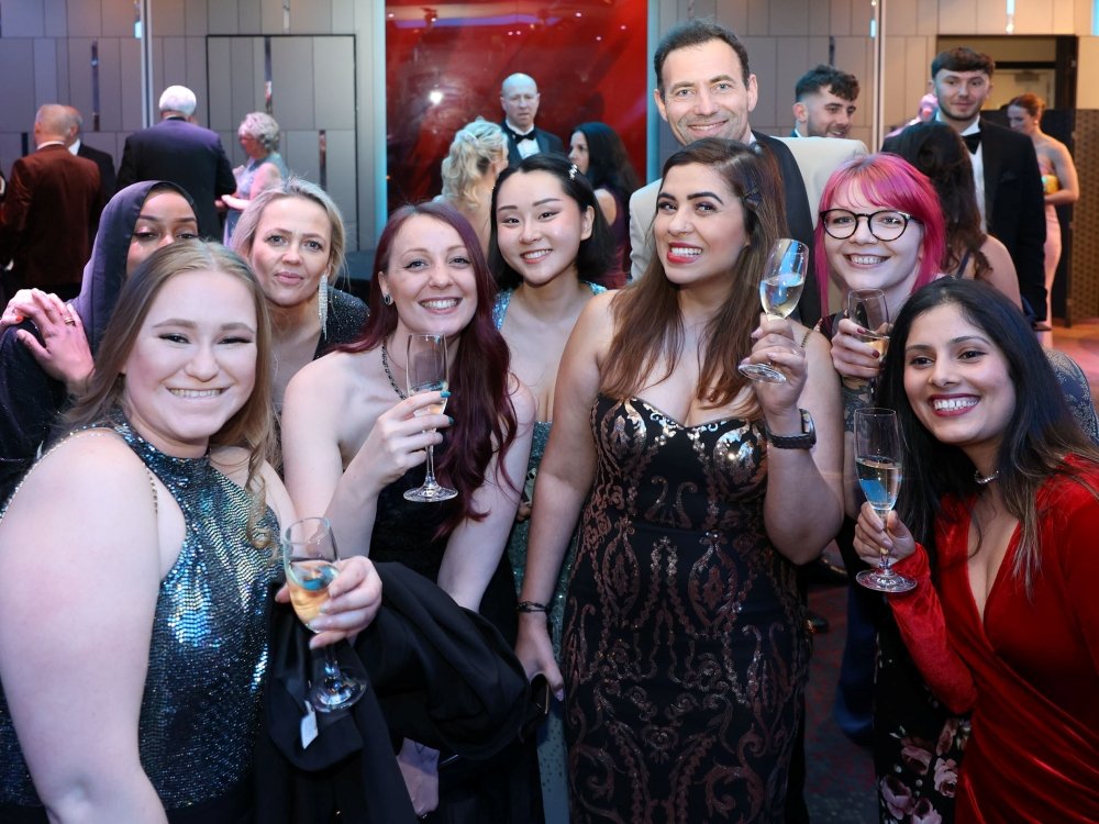Lily Charity Ball 2026 – Save the Date - A group of people smiling and raising glasses at the Lily Foundation charity ball