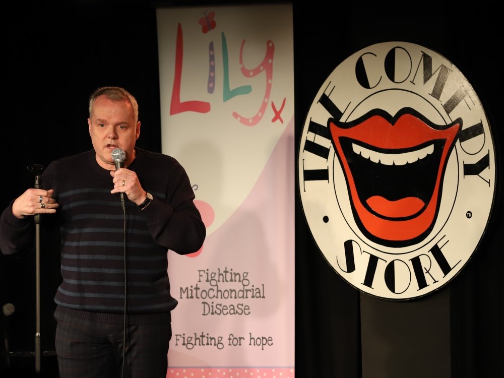Comedian Kevin Day on stage at The Lily Foundation's comedy fundraiser