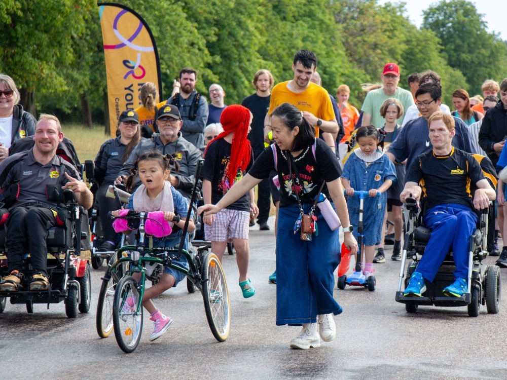 A group of participants of varying ages and physical abilities at the Parallel Windsor inclusive event