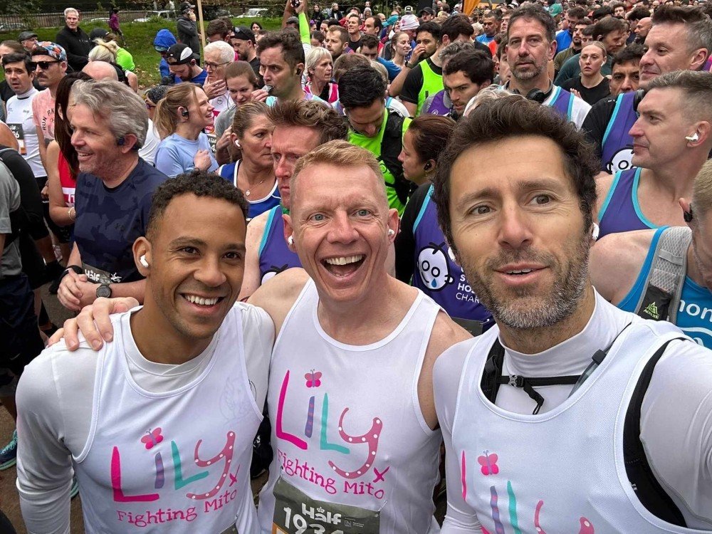 Three men in Lily Foundation tops at the start line for the Royal Parks half marathon