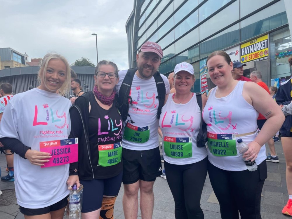 Five Great North Run participants standing in a group wearing Lily Foundation tops