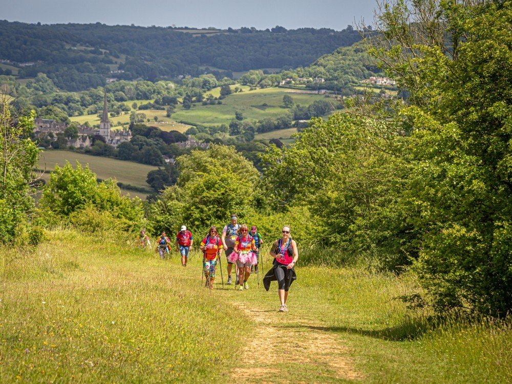 A group of people hiking through the Chilterns countryside in the Ultra Challenge event