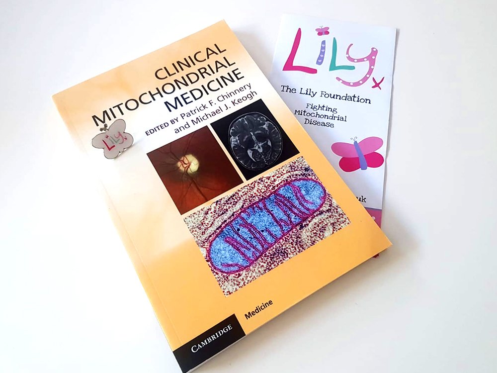 Clinical Mitochondrial Medicine book with a Lily Leaflet on a table top