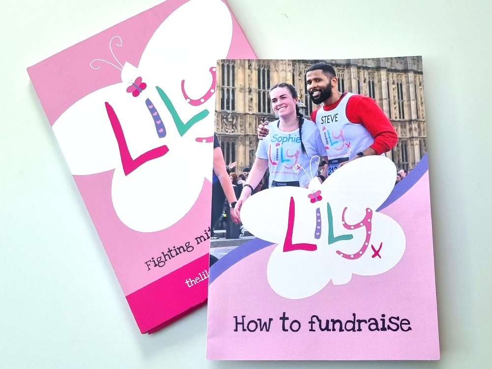 Pink fundraising booklet with large white Lily branded butterfly and 2 fundraisers taking part in a London run