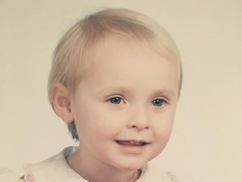 Close-up of a young mito patient with blonde hair and blue eyes