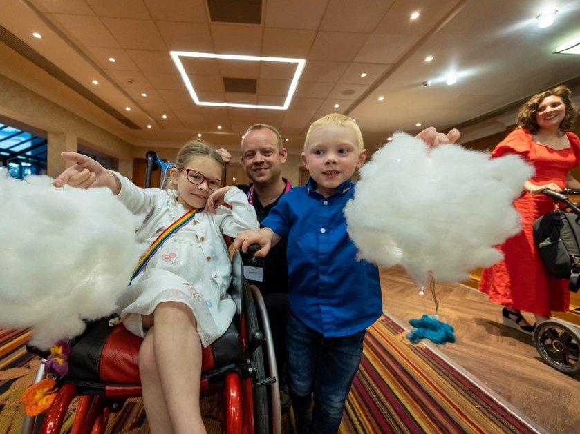 Young mito patient Sophie with her family at the Lily family support weekend