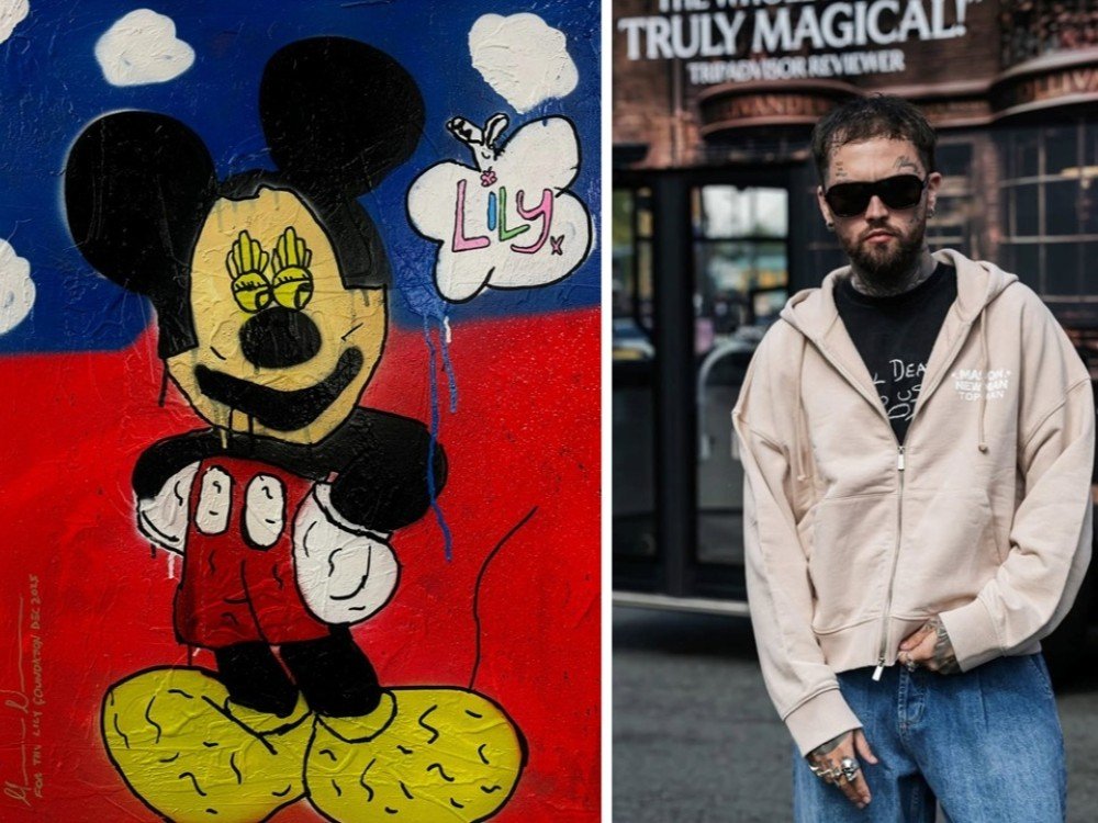 A piece of artwork featuring Mickey Mouse and the artist, Mason Newman, standing next to it