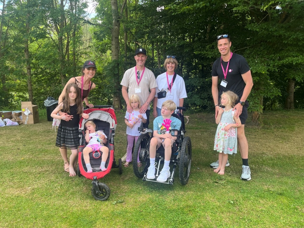 A group of mito parents and children standing together at the Lily Family Support Weekend