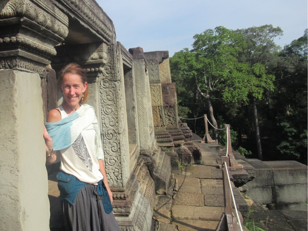 Mitochondrial disease patient Rachel standing at Angkor Wat, Cambodia
