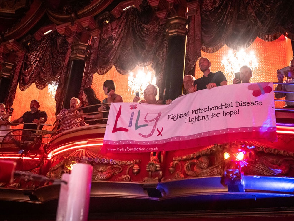 A large Lily Foundation banner hangs from the balcony at the Lily Fight Night