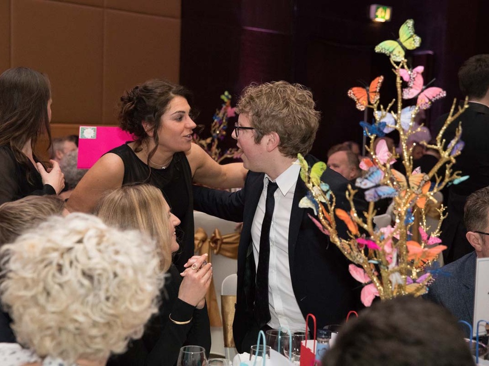 Lily founder Liz chatting with comedian Josh Widdicombe at the Lily ball