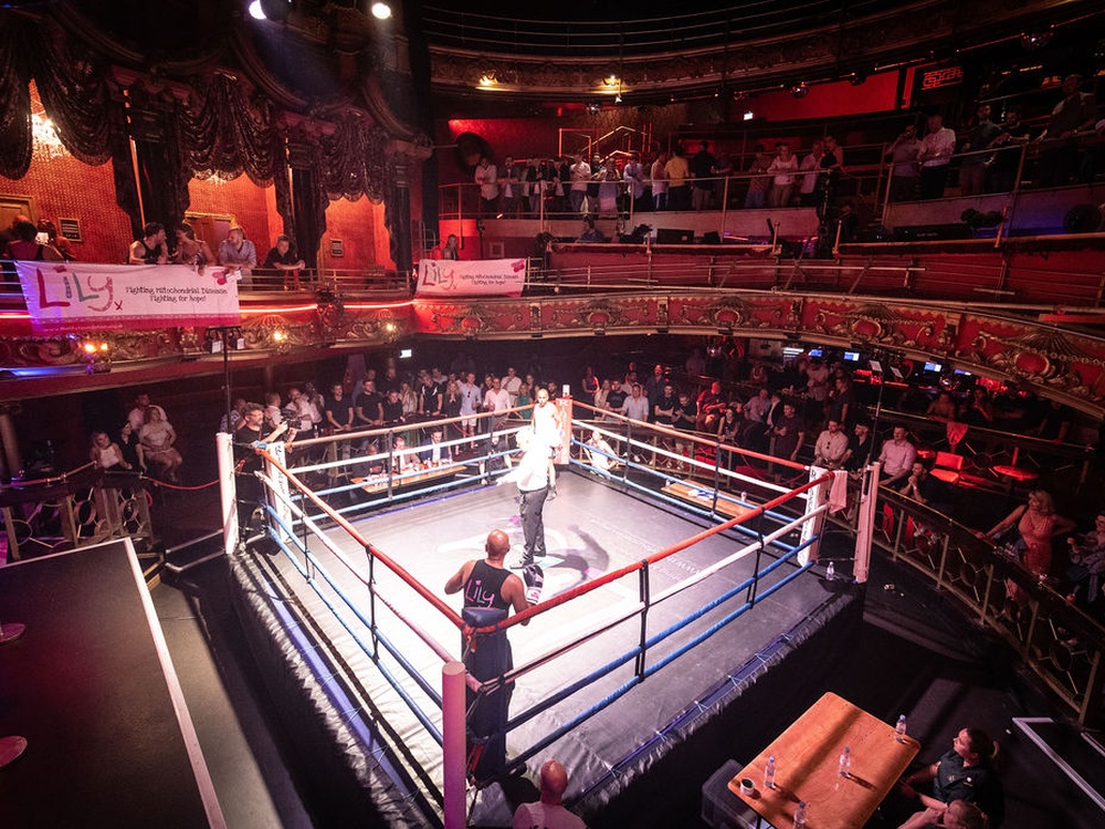 The boxing ring and spectators at the Clapham Grand