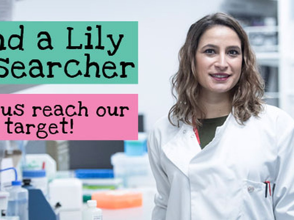 Lily Research brings hope and positive change - A lady in a white lab coat standing in a science lab