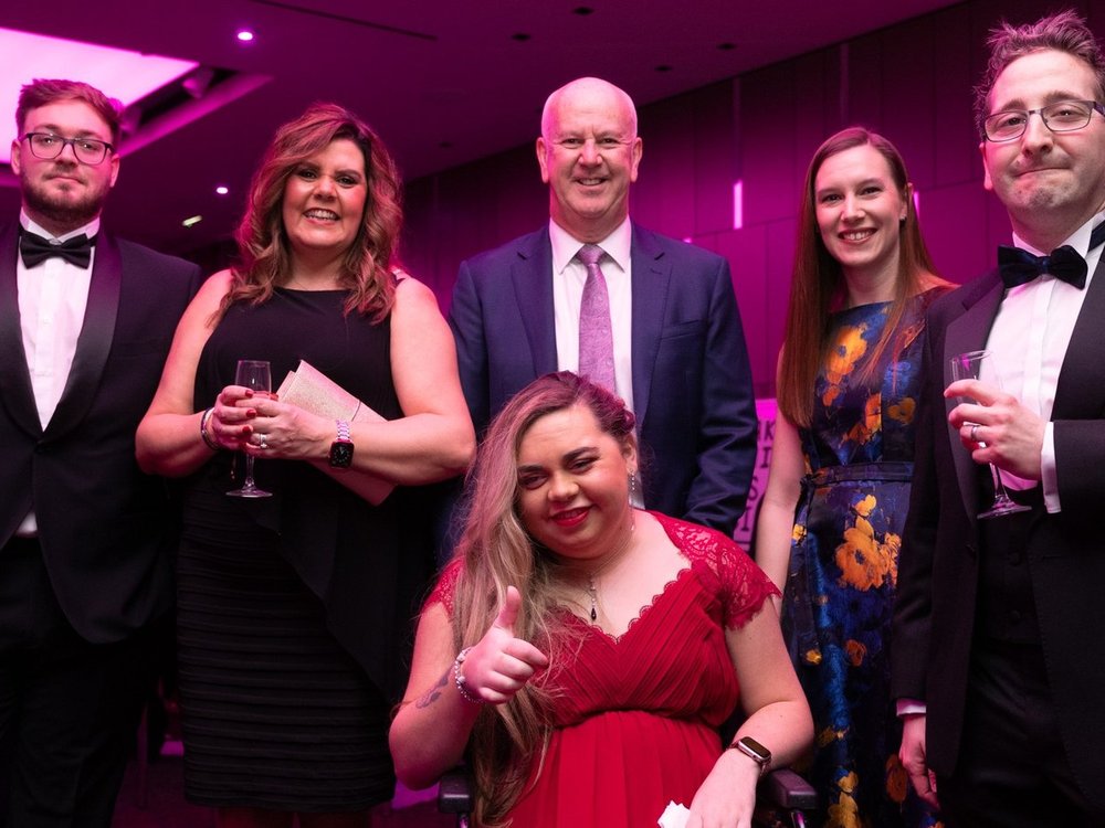 Celebrating 15 years of... Lily friendship - A group of people in their finest party clothes standing together at the Lily Foundation charity ball
