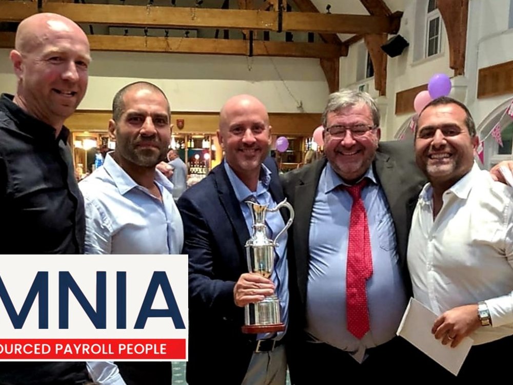 Who will win the Lily Cup? - A group of men standing together in the clubhouse at Croham Hurst Golf Club, one is holding a silver cup