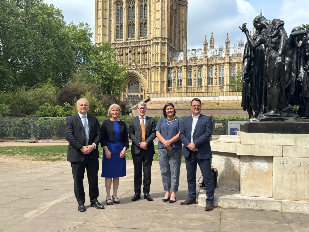 The five project leads from the LifeArc Centre standing in front of the House of Lords