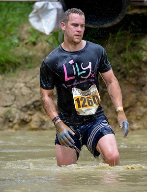 Volunteer fundraiser Neil Harper competes in a Muddy Furlong event to raise money for The Lily Foundation 